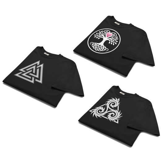 Three folded black t-shirts displaying Norse symbols: a white and silver Valknut, a white Yggdrasil tree of life with a pink heart, and a white dramatic triskelion graphic.