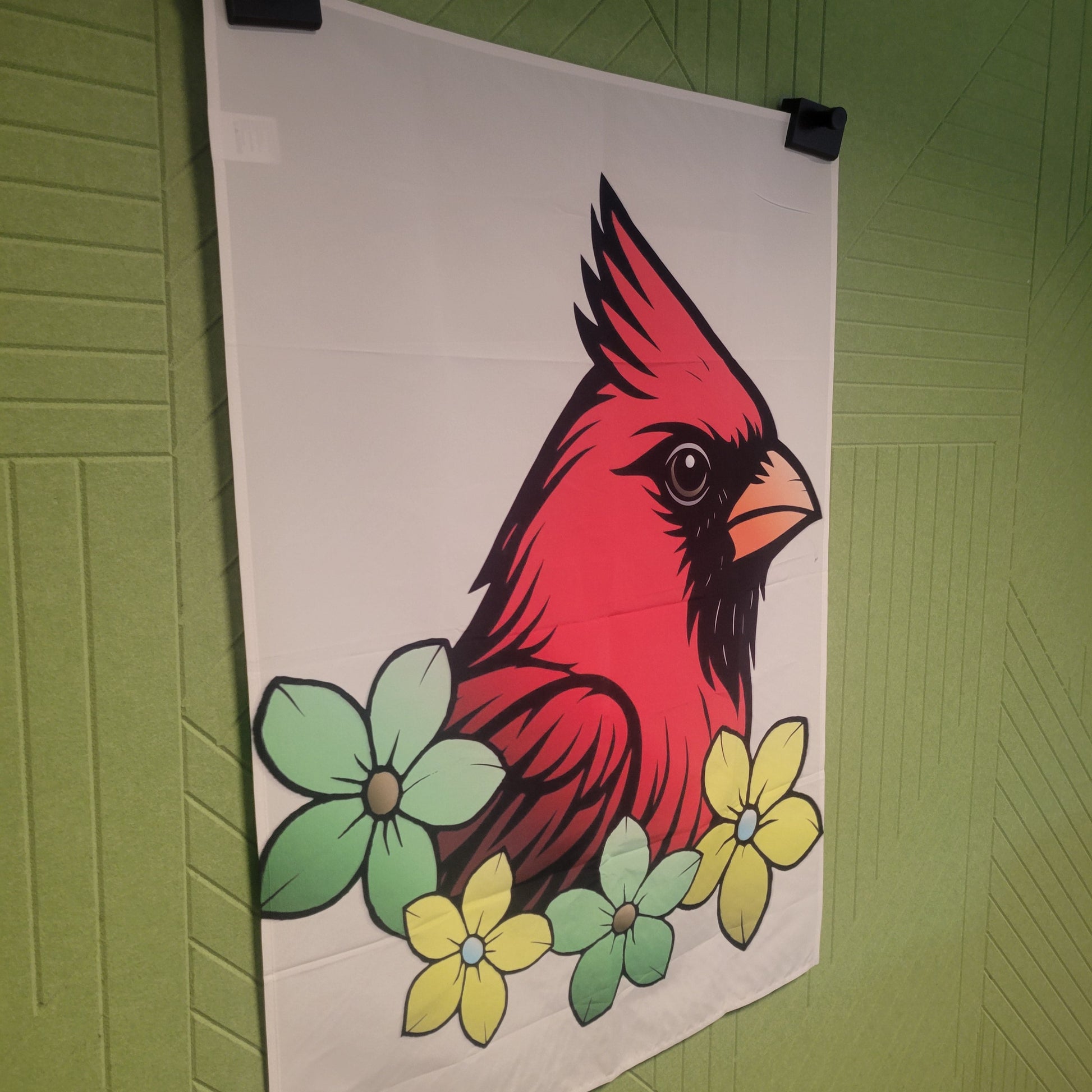 Bold comic-style illustration of a red cardinal from a left side angle with black markings and orange beak, surrounded by mint green and yellow flowers on a beige background; wall tapestry.