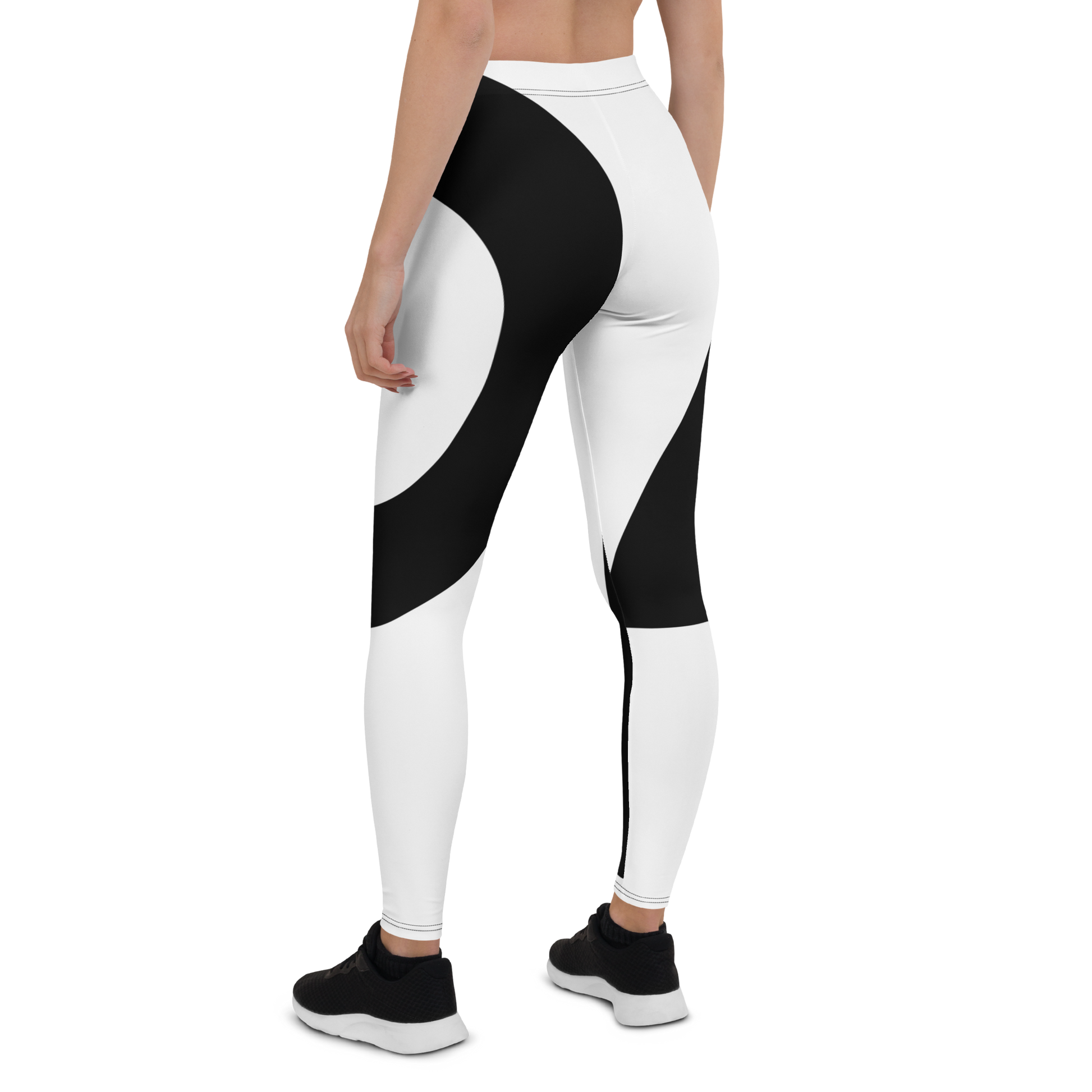 High-waisted leggings with bold black and white LP logo sweeping curve print, shown from the back left on a female model wearing black sneakers.