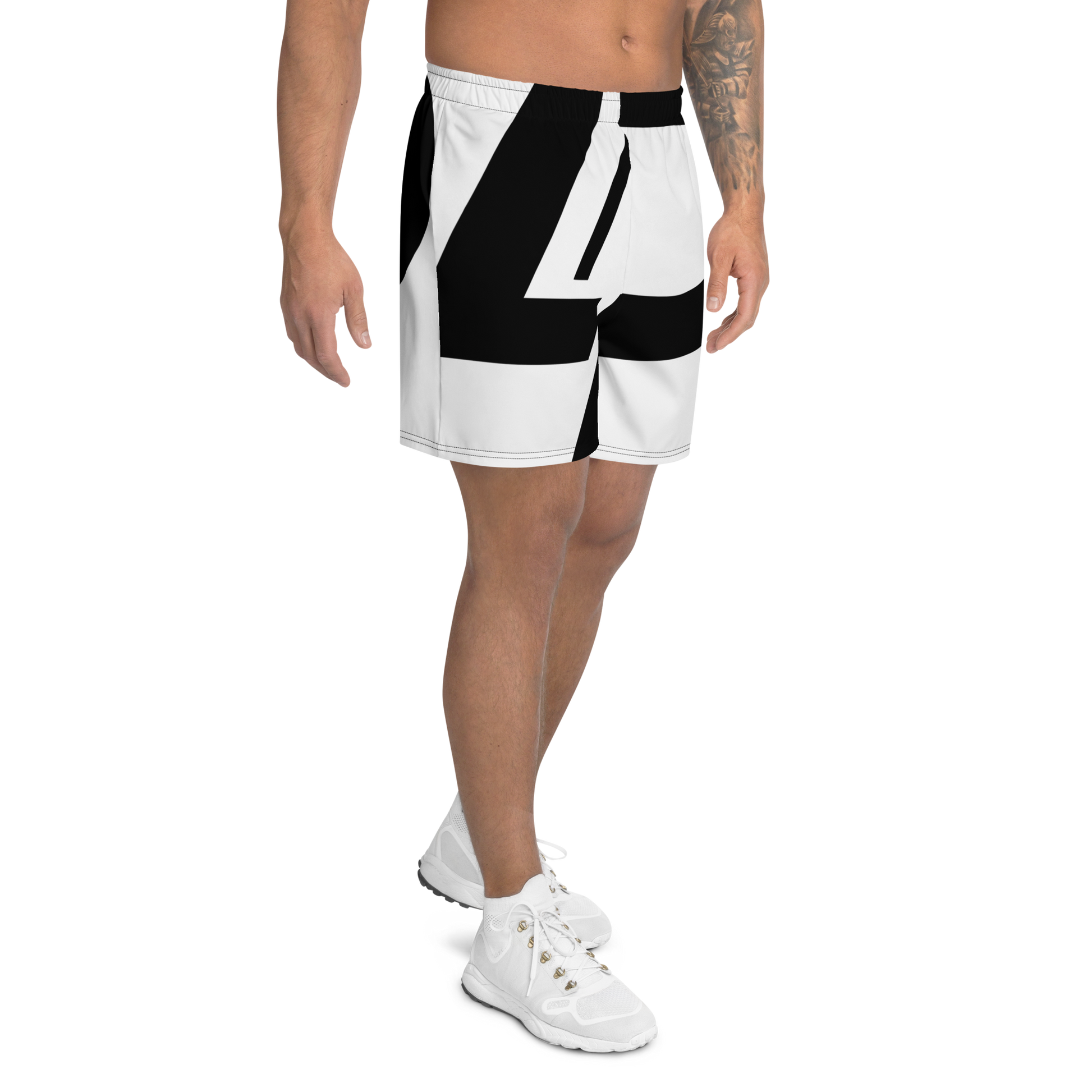 Men's athletic shorts with bold oversized black graphic lettering on a white background, shown on a male model from a front right angle. Apparel.
