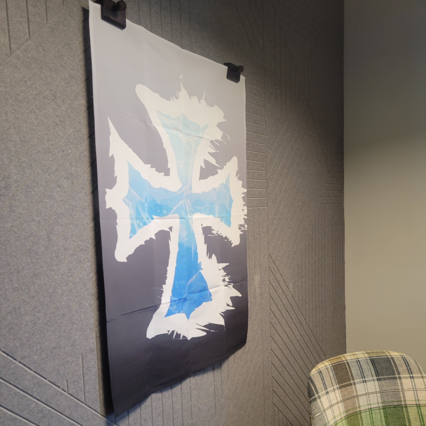 Dark tapestry featuring a jagged, battle-worn cross in icy blue gradient with white shattered-edge detailing on a gray-to-black gradient background, wall tapestry.