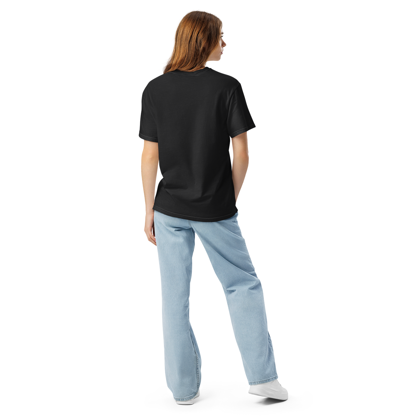 Back view of a woman wearing a plain black oversized t-shirt with light wash wide-leg jeans, shown against a transparent background. Apparel.