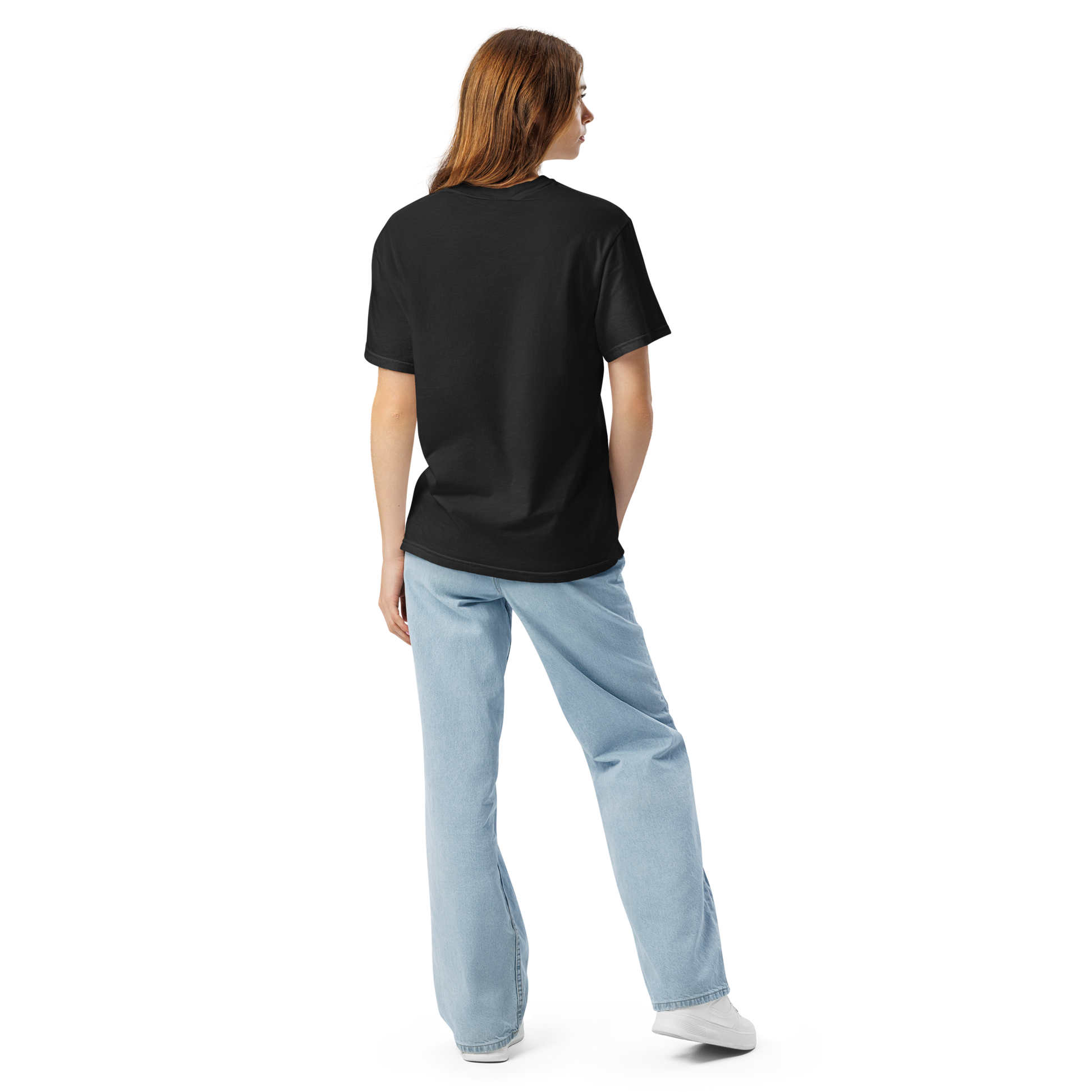 Back view of a woman wearing a plain black oversized t-shirt with light wash wide-leg jeans, shown against a transparent background. Apparel.