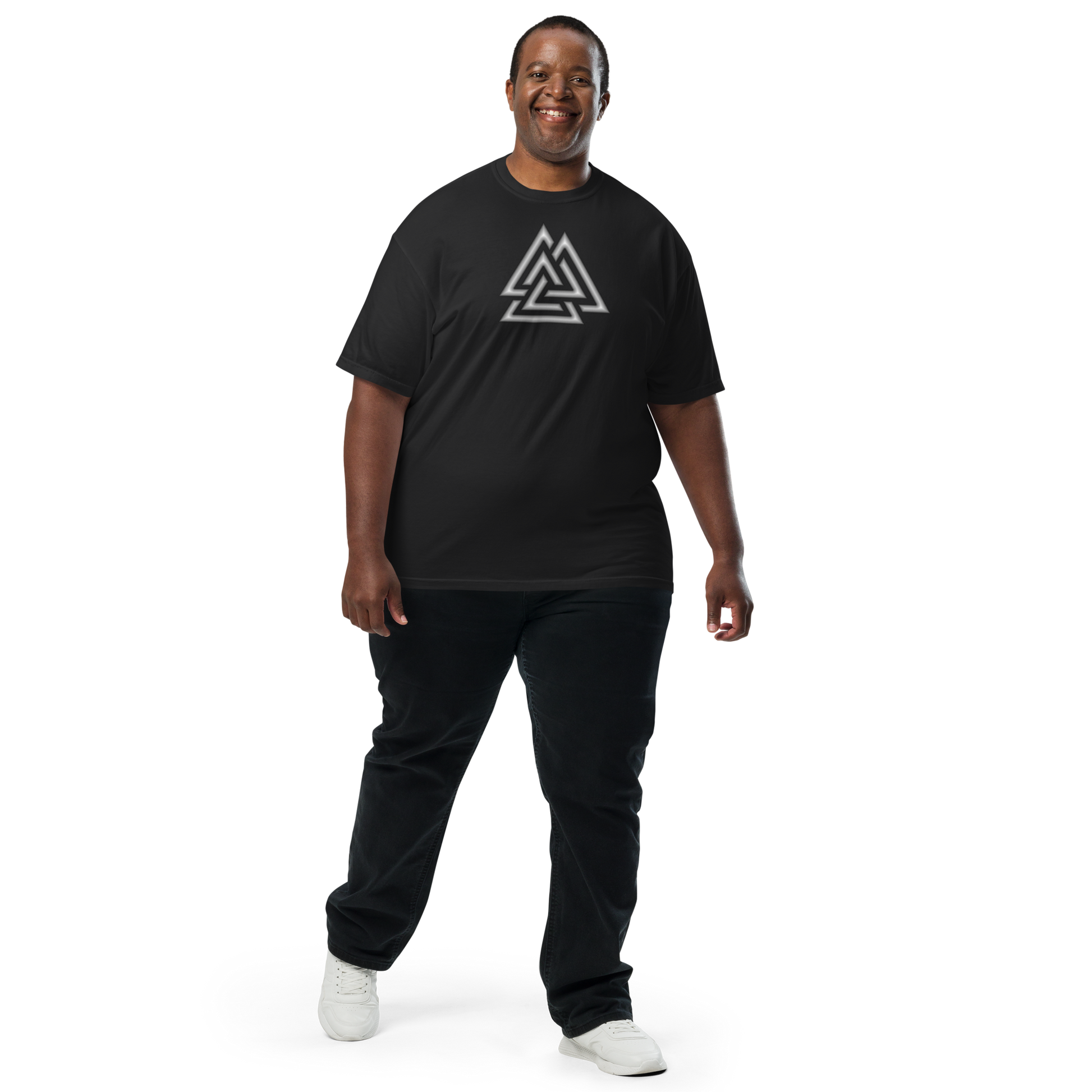 Smiling man wearing a black oversized t-shirt featuring a silver and white Valknut — three interlocked triangles centered on the chest. Apparel.