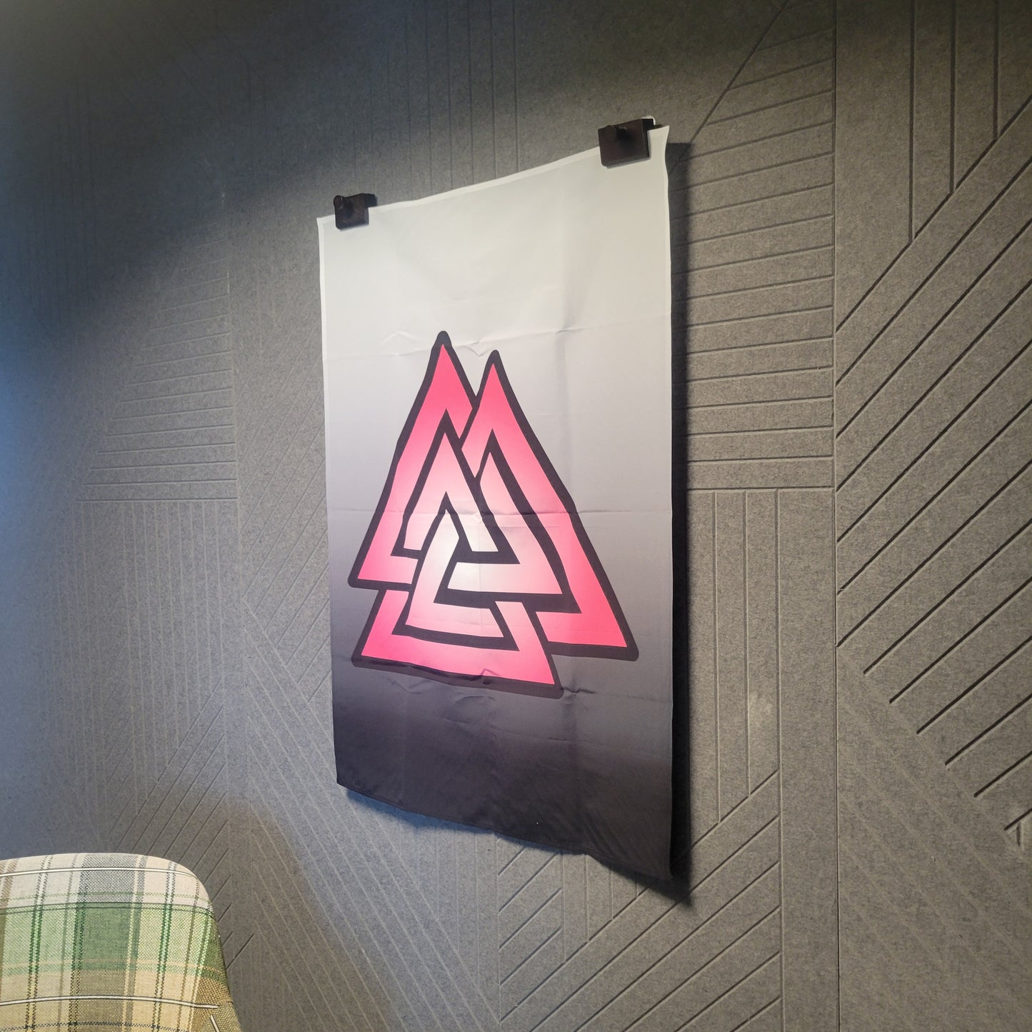 Hanging pink and white gradient Valknut symbol with bold black outline on a white-to-charcoal gradient background, wall tapestry.